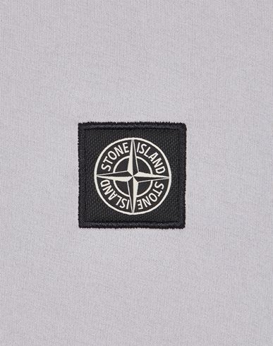 Stone island t shirt with badge sale on sleeve