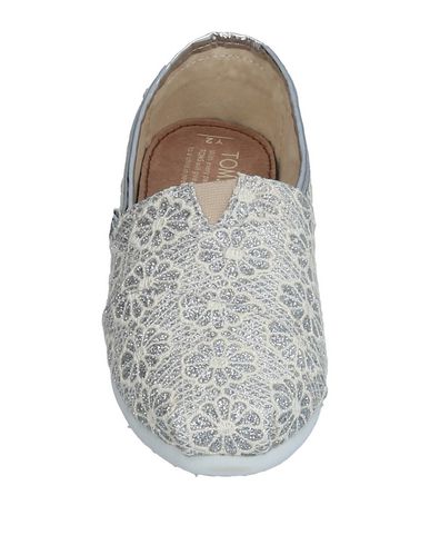 фото Низкие кеды и кроссовки Toms