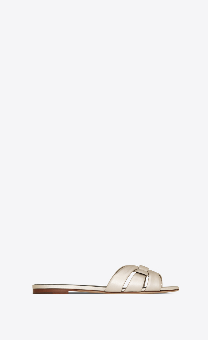 Click to view more detailed imagery on our partner's website Saint Laurent Tribute Flat Sandals In Metallic Leather In Pale Gold