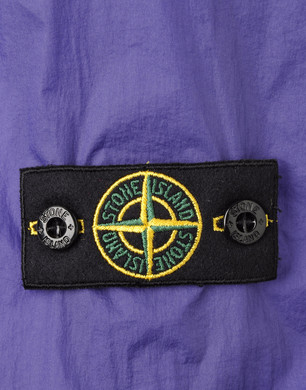 stone island jumper badge on front
