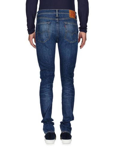 фото Джинсовые брюки Levi's red tab