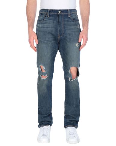 фото Джинсовые брюки Levi's red tab