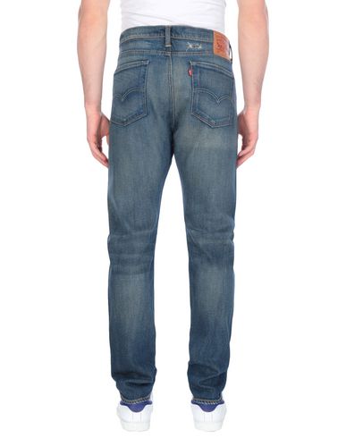 фото Джинсовые брюки Levi's red tab