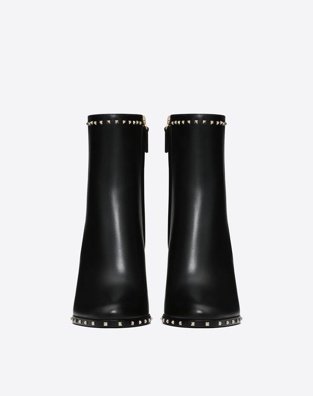 black boots with studs around sole