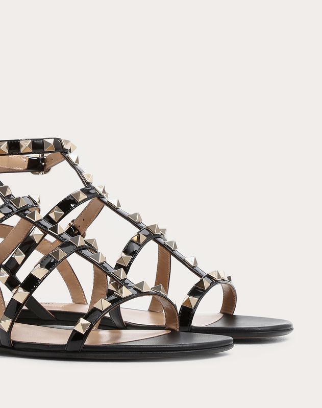 Patent Cage Rockstud Flat Sandal for Woman | Valentino Online Boutique