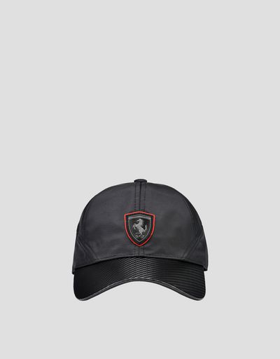 Black cap with visor with carbon fibre effect