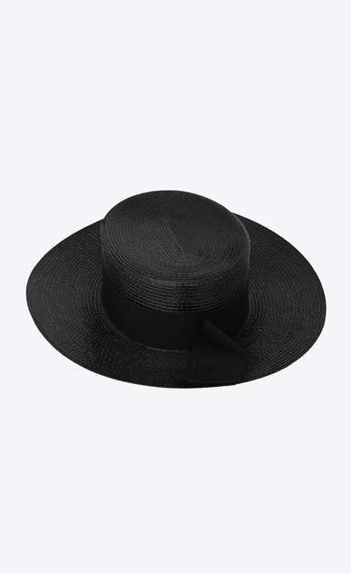 Large boater hat in varnished straw