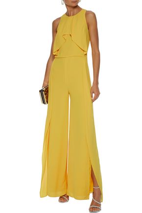 Click to view more detailed imagery on our partner's website Halston Heritage Sleeveless High-Neck Flowy Drape Front Wide-Leg Jumpsuit In Marigold
