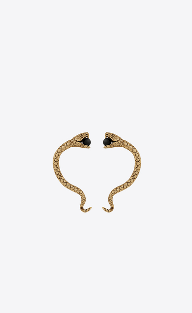Snake ear jewelry in gold metal and black glass beads.
