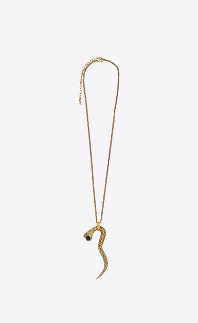Pendentif SERPENT en métal doré et perle de verre noire.