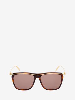 Sonnenbrille mit geschwungenem Metallelement Sonnenbrille mit geschwungenem Metallelement